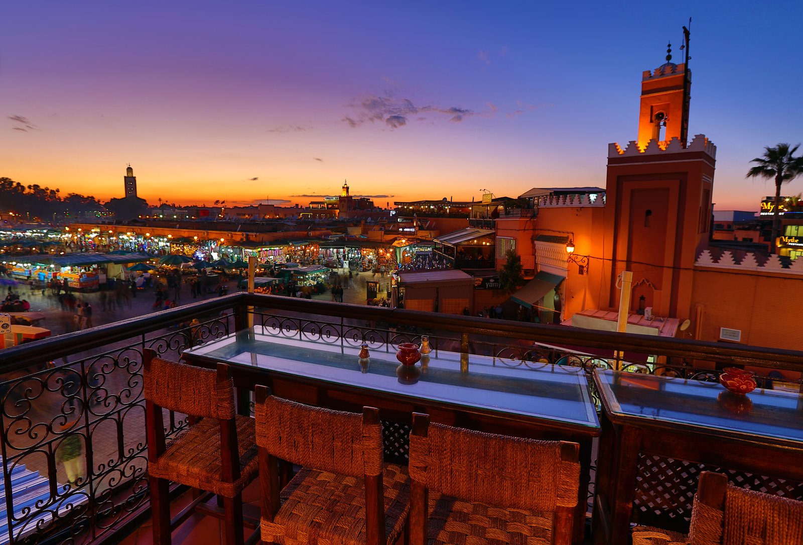 Famous Jemaa el Fna square crowded at dusk. Marrakesh, Morocco